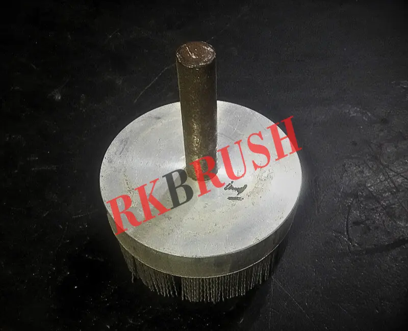 Abrasive nylon spindle mounted disc brush